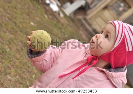 baby and tennis ball