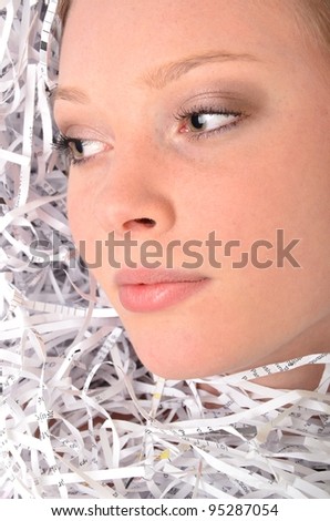 woman with a pile of shredded paper