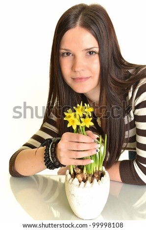 Beautiful young woman with narcissus