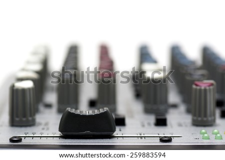 Sound editing, recording equipment\'s; mixer; volume knob close up.