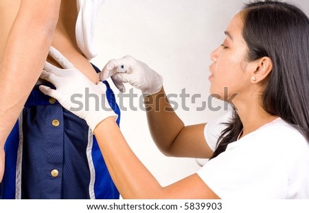 Nurse checking proper way to inject the medicine.