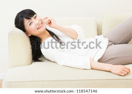 The woman who talks on the telephone in a sofa