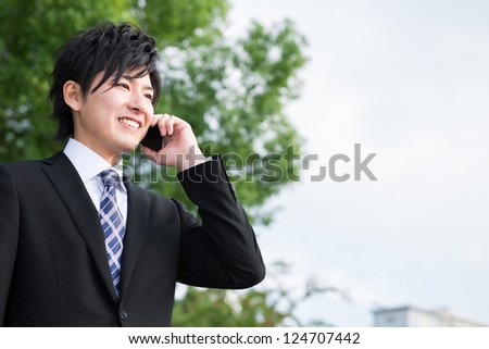 The Young businessman who talks on the telephone