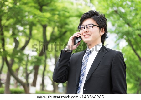 Young businessman who talks on the telephone