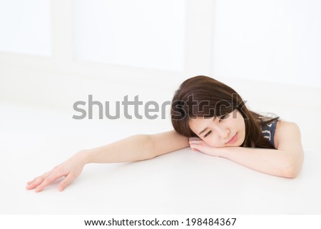 Beautiful young asian woman who gets tired