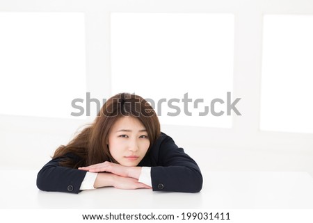 Beautiful young asian woman who gets tired