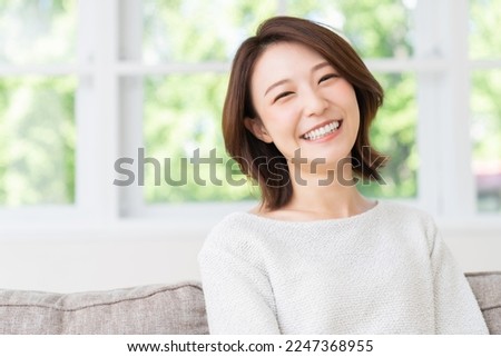 Similar – Image, Stock Photo Young woman with short brunette hair looks out the window behind the glass