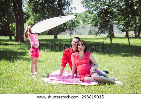 Happy family having photo session in summer park