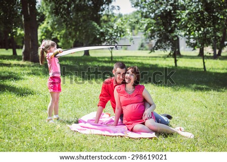 Happy family having photo session in summer park
