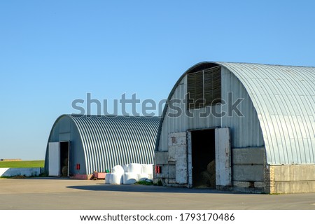 Arched hangars, Large storage for agricultural crops. Farm buildings. Foto d'archivio © 
