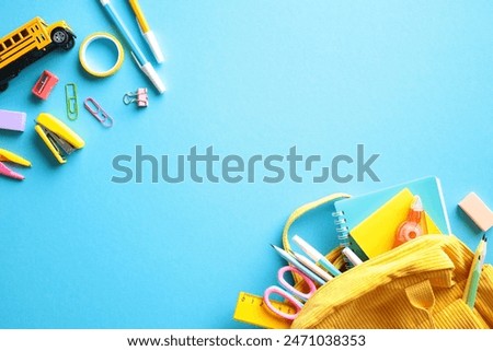 Similar – Image, Stock Photo blue notebook and scattered wooden multi-colored letters on an abstract background
