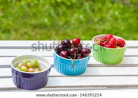 Fresh fruits in colorful fruit bowls