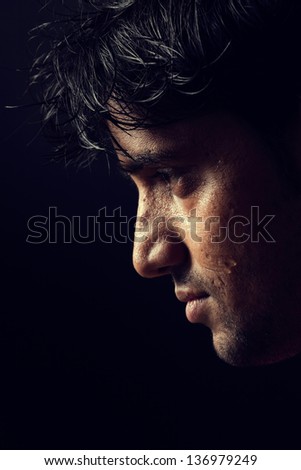 portrait of Indian man over dark background (Grains & textures are added extra)