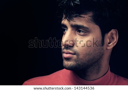 portrait of Indian man over dark background, Grains & textures are added