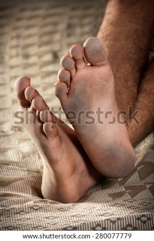 Close up of very dirty feet of man
