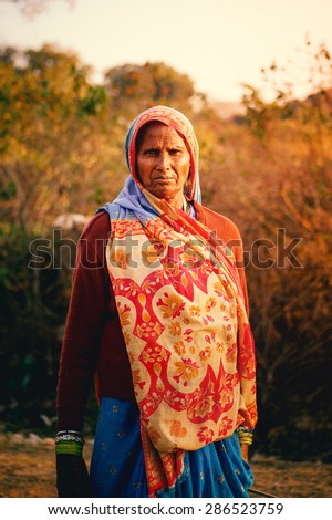 Indian village lifestyle. Middle age indian villager woman with dark complexion looking at camera. Lalitpur, Uttar Pradesh (India) on Jan 16 2012.