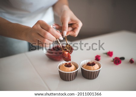 Similar – Image, Stock Photo Housewife making strawberry jam. Woman cutting fruits