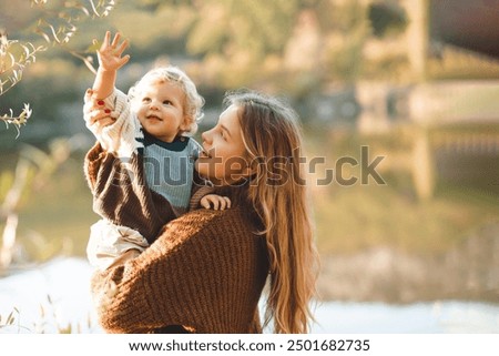 Similar – Image, Stock Photo The girl with the blue eyes is by no means as strict as her accurate parting.