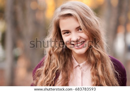 Smiling Blonde Teenage Girl 14 16 Year Old With Curly Long Hair Outdoors Looking Smiling Blonde Teenage Girl 14 16 Year Old With Curly Long Hair Outdoors Looking