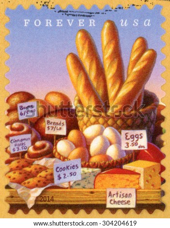 UNITED STATES OF AMERICA - CIRCA 2014: forever stamp printed in USA shows table with food product; baguettes, buns, cinnamon rolls, breads, cookies, eggs & artisan cheese; farmerÃ¢Â?Â?s markets; circa 2014