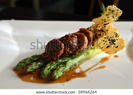 Duck stuffed vegetable by under cognac sauce with an asparagus