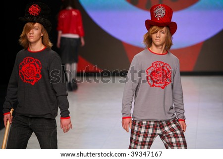 KIEV, UKRAINE - OCT 15: Two models of the twins poses at the runway during Fashion Show by \