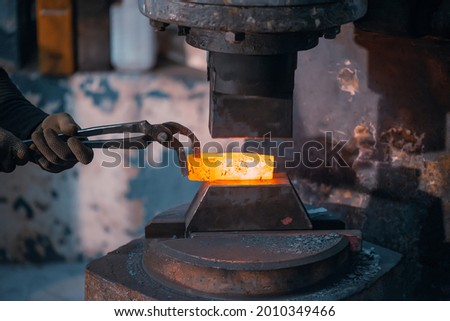 Similar – Image, Stock Photo Blacksmiths forging hot metal with hammer in workshop