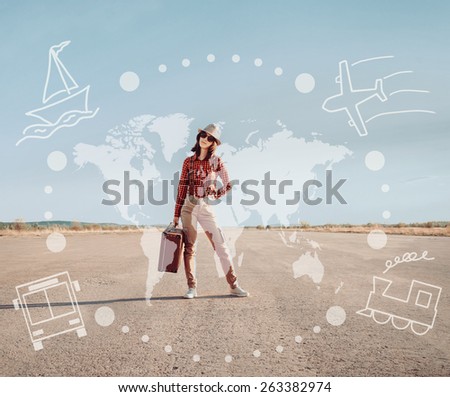 Traveler young woman stands on road with a suitcase. Map of the world and types of transport on image. Concept of travel