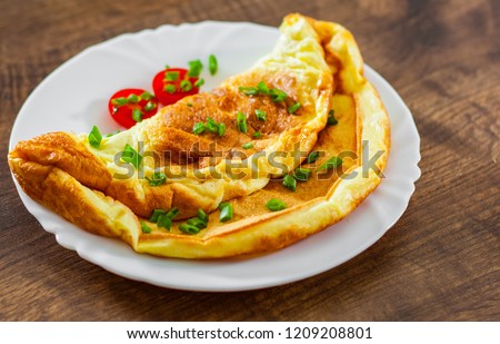 omelette in a white plate on wooden table Stock fotó © 