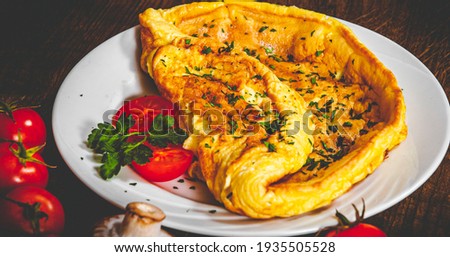 omelette in a plate on wooden table Stock fotó © 