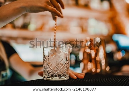 Image, Stock Photo Woman pouring cocktail in metal mug