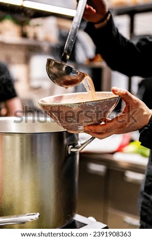 Similar – Image, Stock Photo Preparation of soup in a pot, in nature.