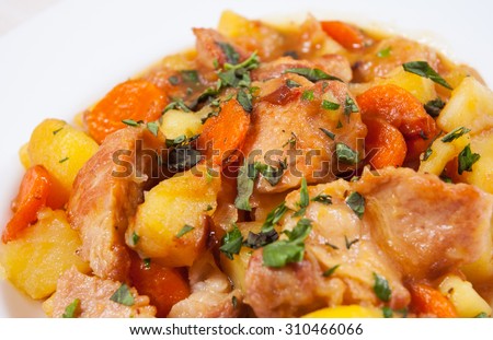 stewed meat with potatoes, onion and carrot