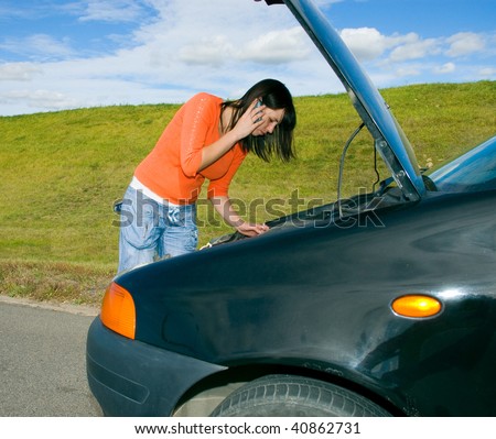 Woman repairing a motor vehicle