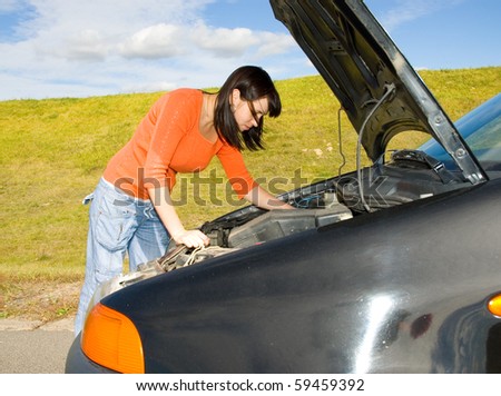 woman repairing the car