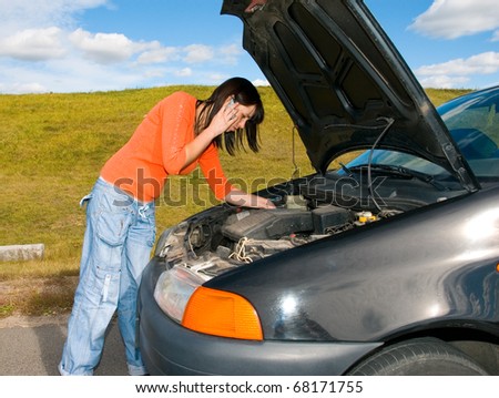 woman repairing the car