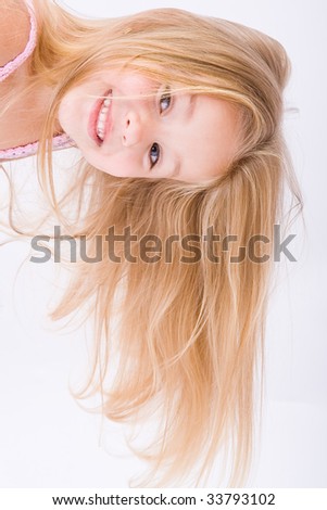 Beautiful little girl with long blonde hair