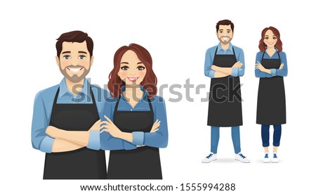 Smiling young man and woman in black aprons standing isolated vector illustration