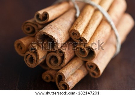 cinnamon sticks on wooden surface