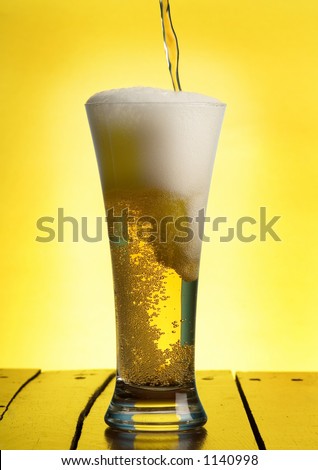 pouring beer in a glass