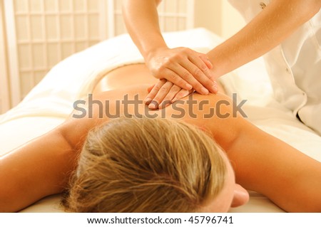 Beautiful woman in a spa with massage therapy