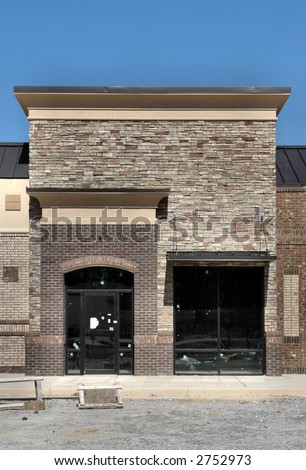 A shopping center storefront under construction, made to appear like a small town street.