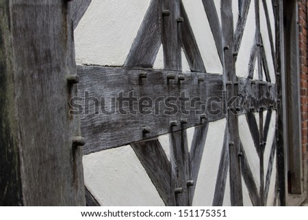 Wooden beams in a Tudor building showing the wooden pegs used instead of nails