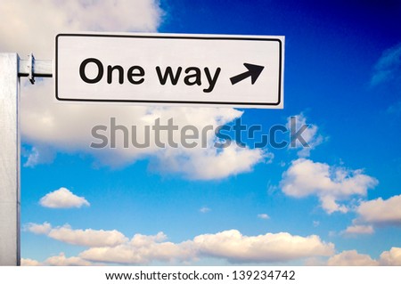 One way sign over the sky