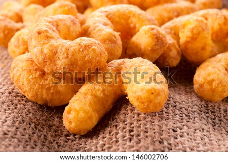 Unhealthy snacks with cheese and peanuts