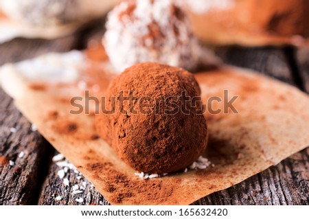 Homemade sweet truffle on the table.Selective focus on the front truffle
