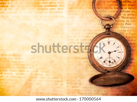 Old watch on the paper with blank space for the text