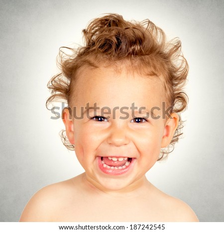 Little child with funny hairstyle screaming