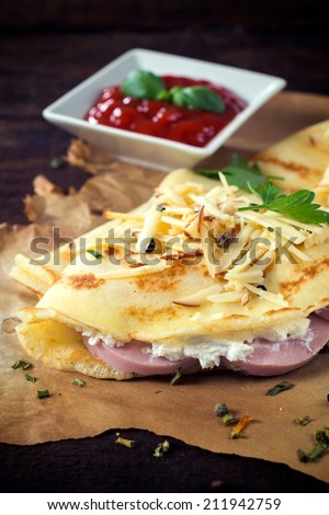 Homemade pancakes stuffed with ham and cheese,selective focus
