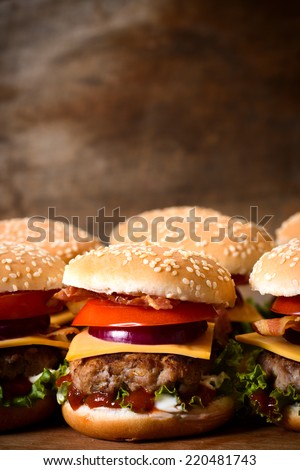 Close up to beef burger with cheese and vegetables.Blank space above